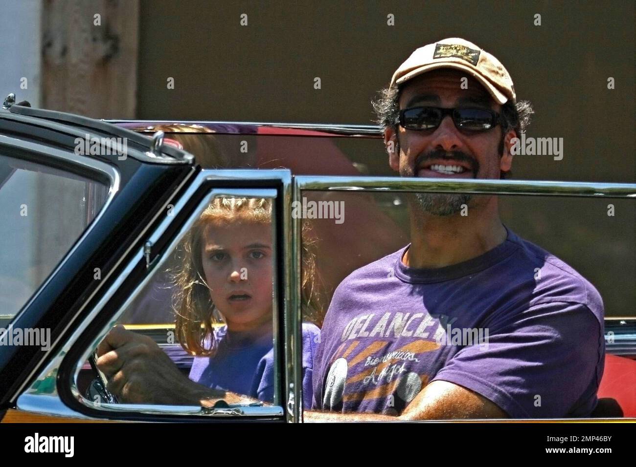 Exclusive!! Brad Garrett looks like a cartoon character behind the wheel of his antique Chrysler Town and Country while out for a drive with the kids in Malibu, CA. 6/29/08. Stock Photo