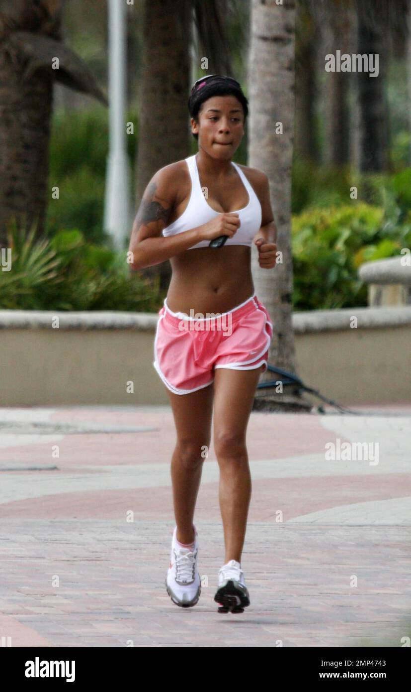 Exclusive!! R&B Singer songwriter Keyshia Cole goes jogging with a freind  on Miami Beach, FL, 7/1/08 Stock Photo - Alamy