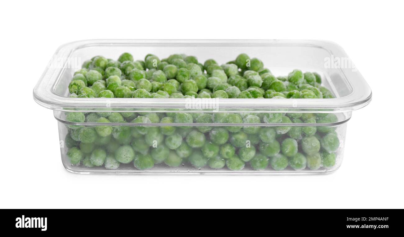 Frozen peas in plastic container isolated on white. Vegetable preservation Stock Photo
