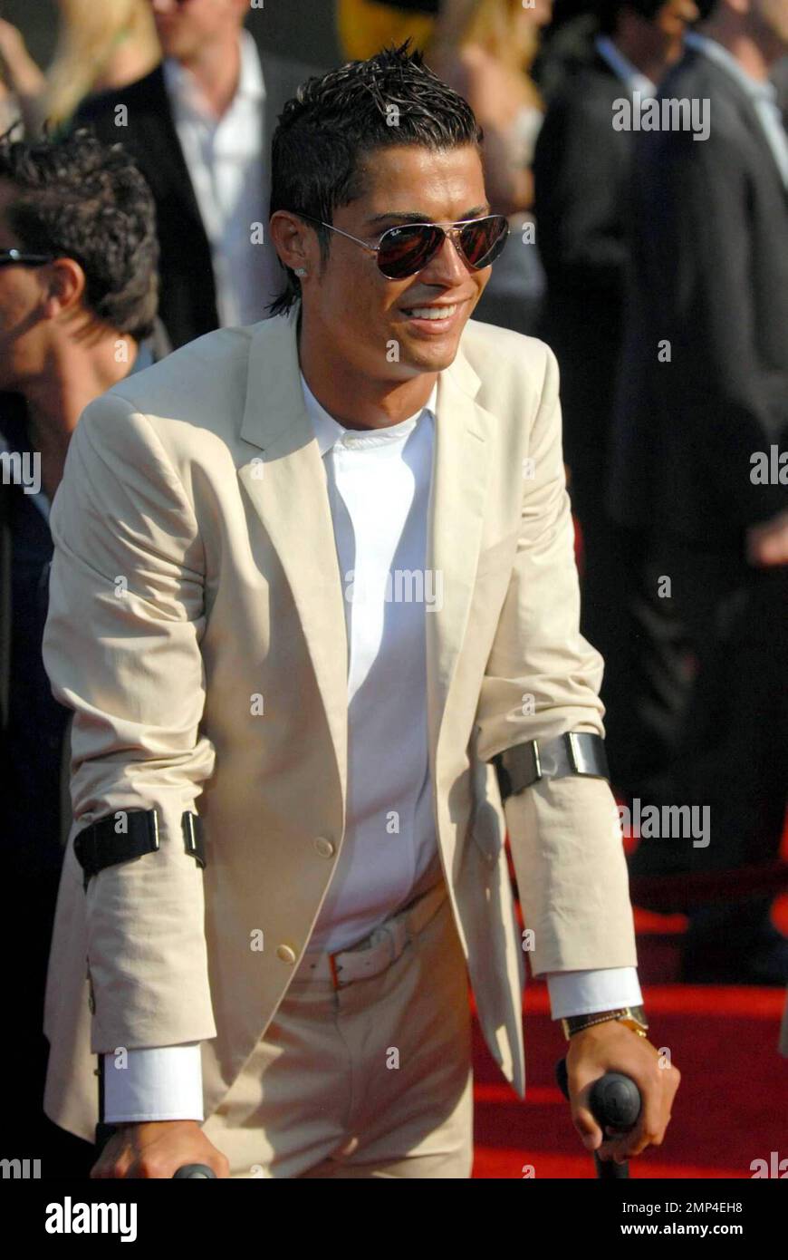 Soccer star Christiano Ronaldo, who recently had ankle surgery, attends