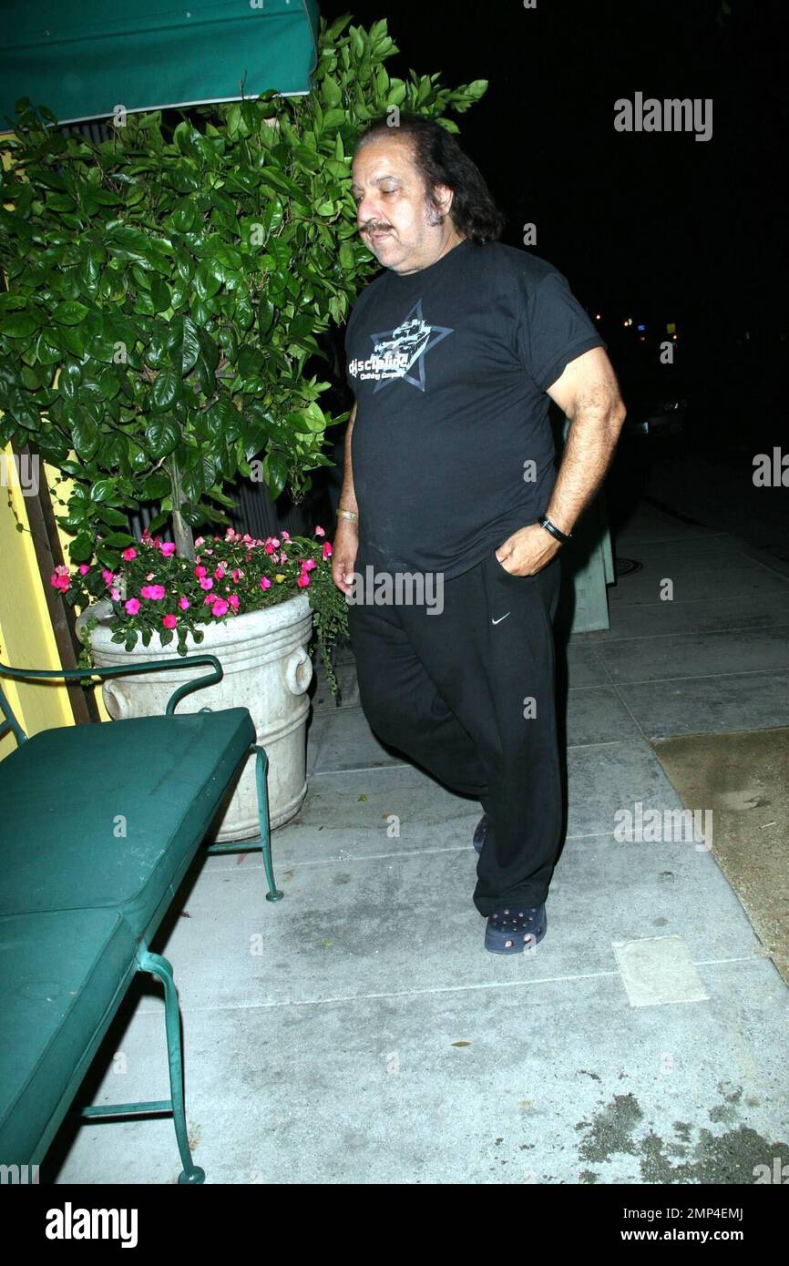 Former adult film star Ron Jeremy takes a break, stopping to sit on a bench, at Dan Tanas. Los Angeles, CA. 7/17/08. Stock Photo