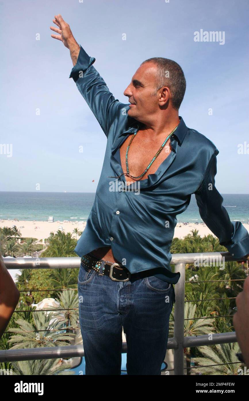 Christian Audigier poses for photos during a press preview shoot during