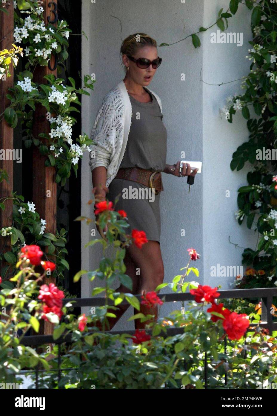 Katherine Heigl picks up 'Grey's Anatomy' castmate and friend T.R. Knight at his house in Los Angeles, knocking on the door before deciding to just yell through his window to announce her arrival. The two then went to visit Katherine's Mom at her house before heading to the Americana Mall in Glendale for a day of shopping. Los Angeles, CA. 7/29/08. Stock Photo