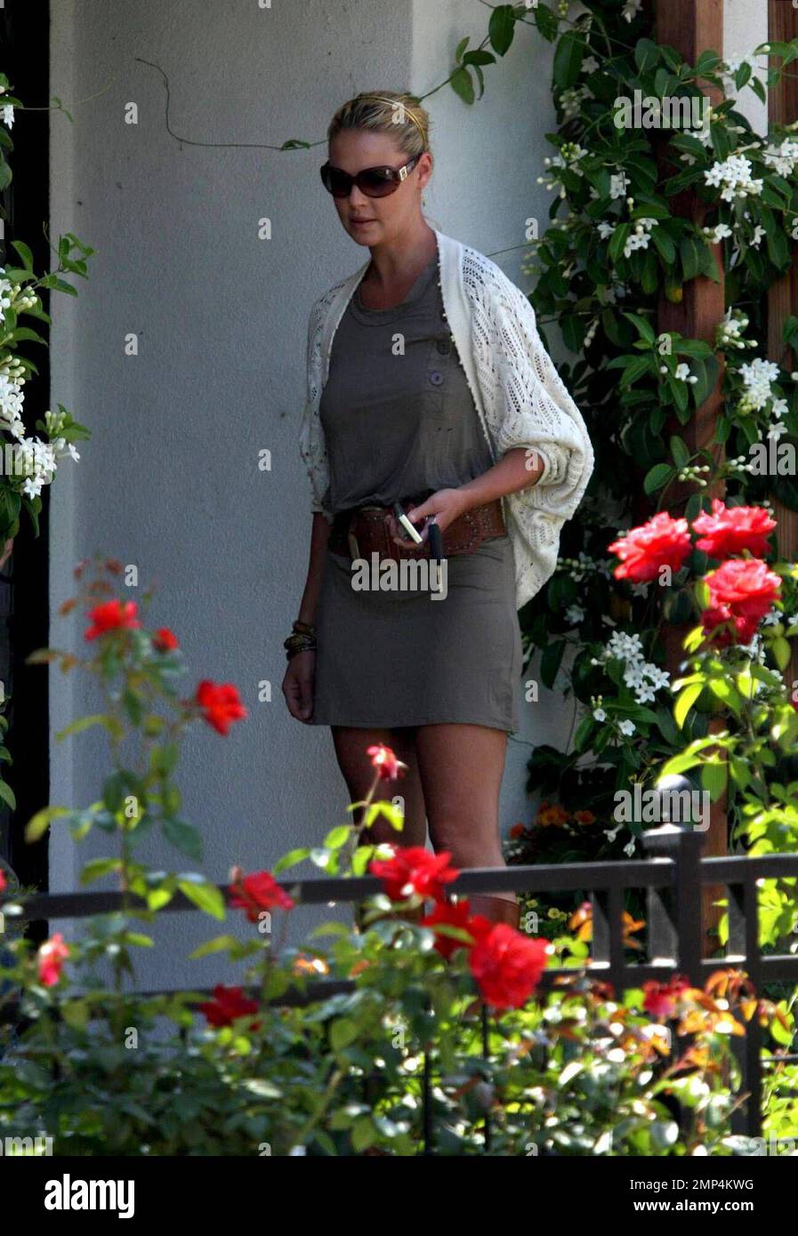 Katherine Heigl picks up 'Grey's Anatomy' castmate and friend T.R. Knight at his house in Los Angeles, knocking on the door before deciding to just yell through his window to announce her arrival. The two then went to visit Katherine's Mom at her house before heading to the Americana Mall in Glendale for a day of shopping. Los Angeles, CA. 7/29/08. Stock Photo