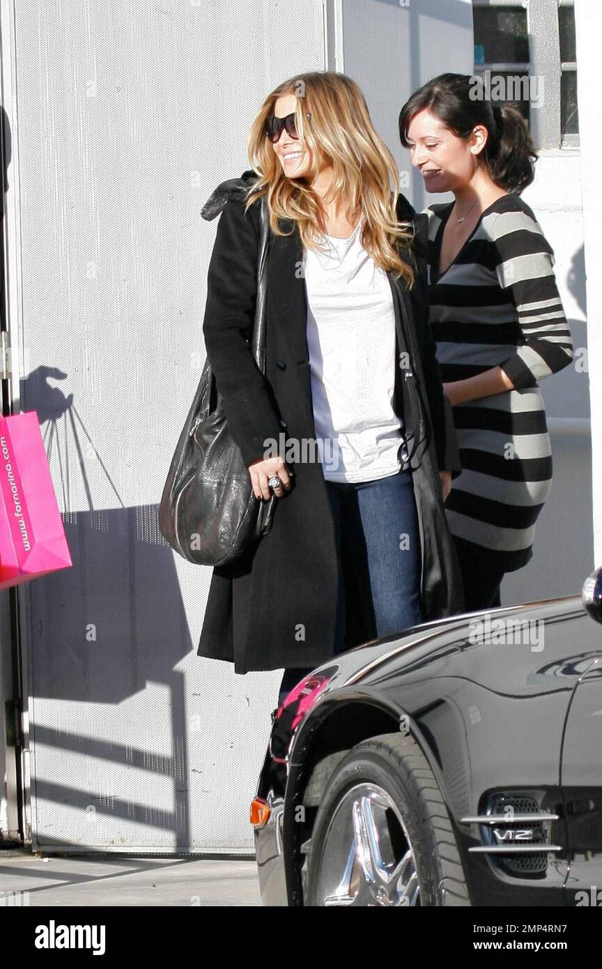 Carmen Electra shops for a new pair of boots at Fornarina on Melrose  Avenue. Her musician fiance Rob Patterson sat patiently whilst the Baywatch  Babe tried on different boots and made her