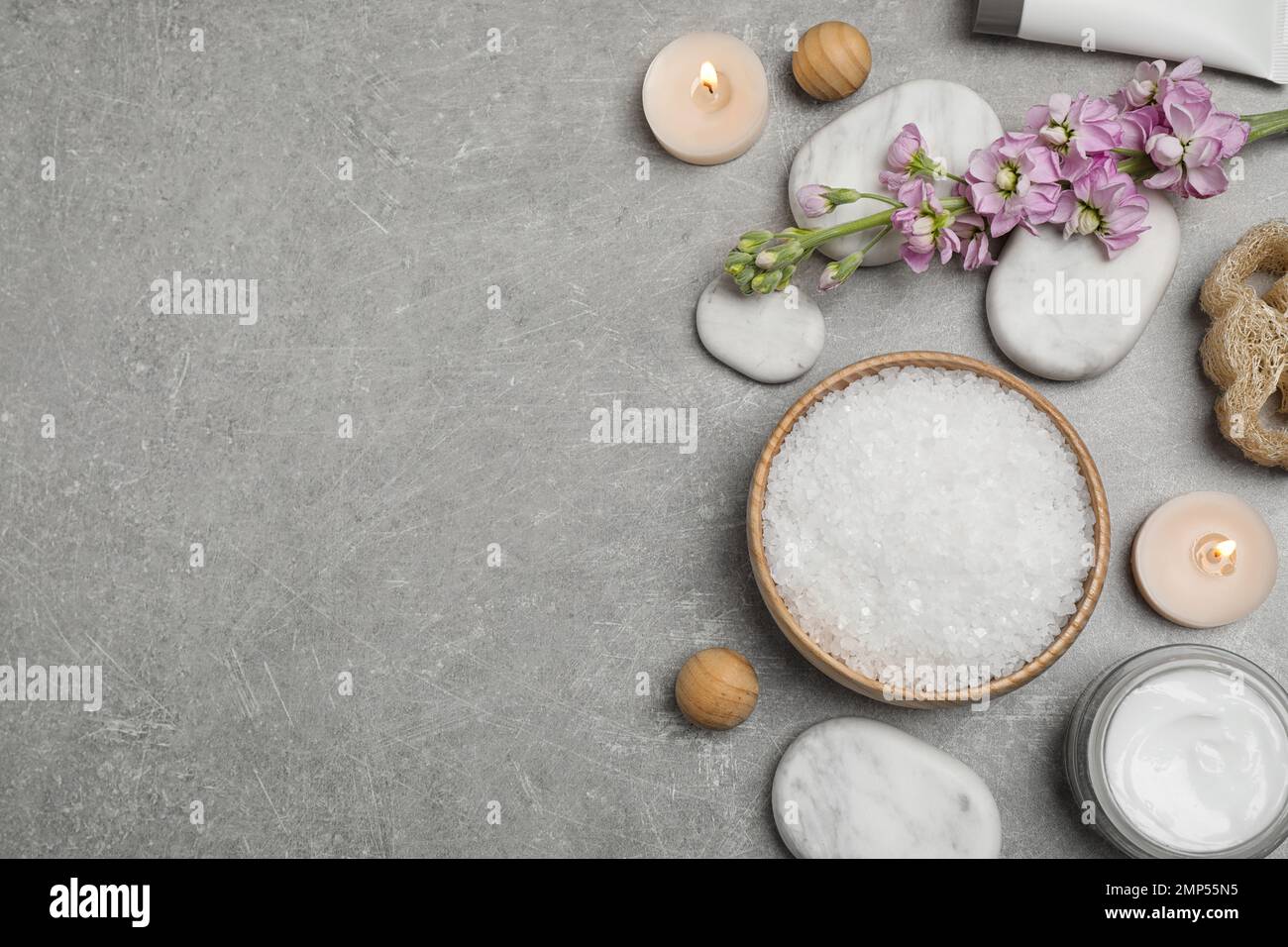 Flat lay composition with cosmetics on grey marble table, space for ...