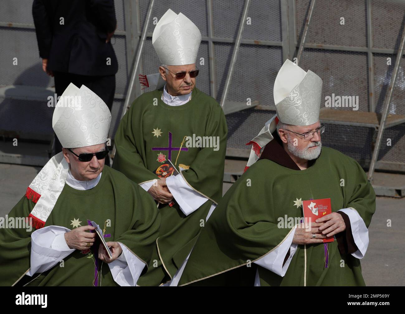 Cardinal Sean Patrick O'Malley, right, arrives for Mass to be ...