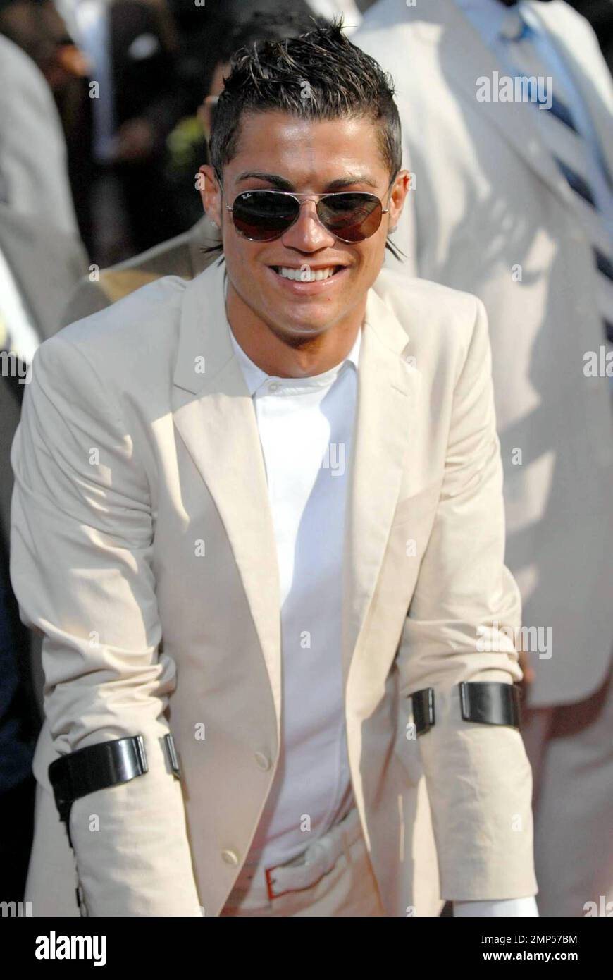 Soccer star Christiano Ronaldo, who recently had ankle surgery, attends