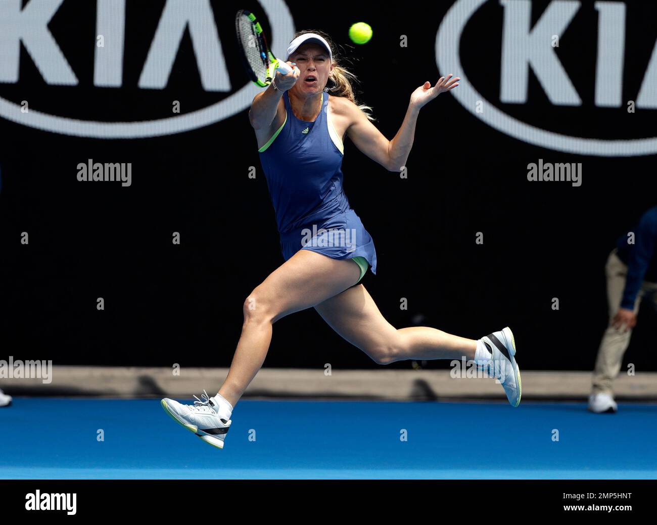 Denmark's Caroline Wozniacki hits forehand return to Slovakia's