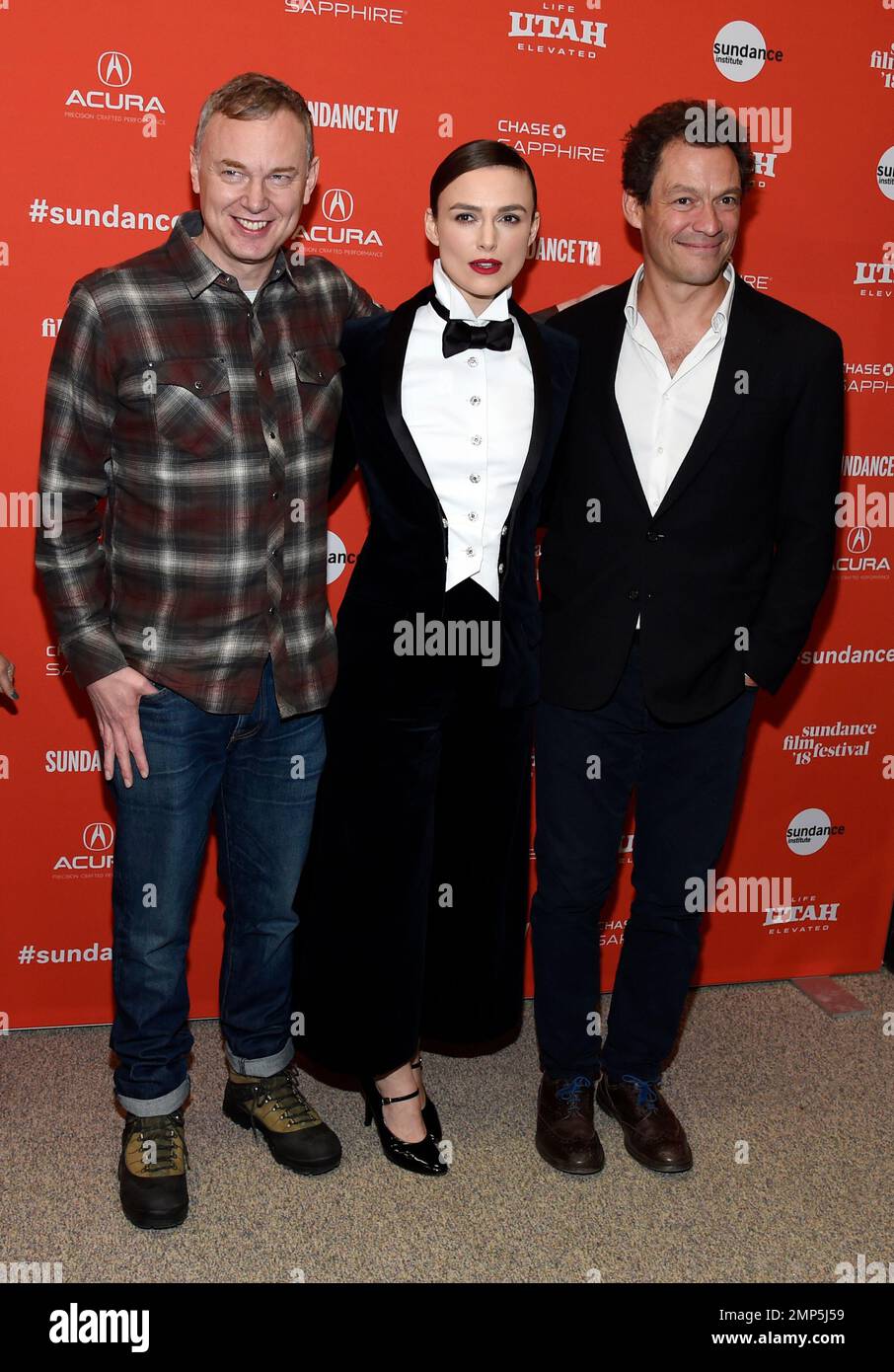 Wash Westmoreland, left, director/co-writer of "Colette," poses with cast  members Keira Knightley, center, and Dominic West at the premiere of the  film at the 2018 Sundance Film Festival on Saturday, Jan. 20,