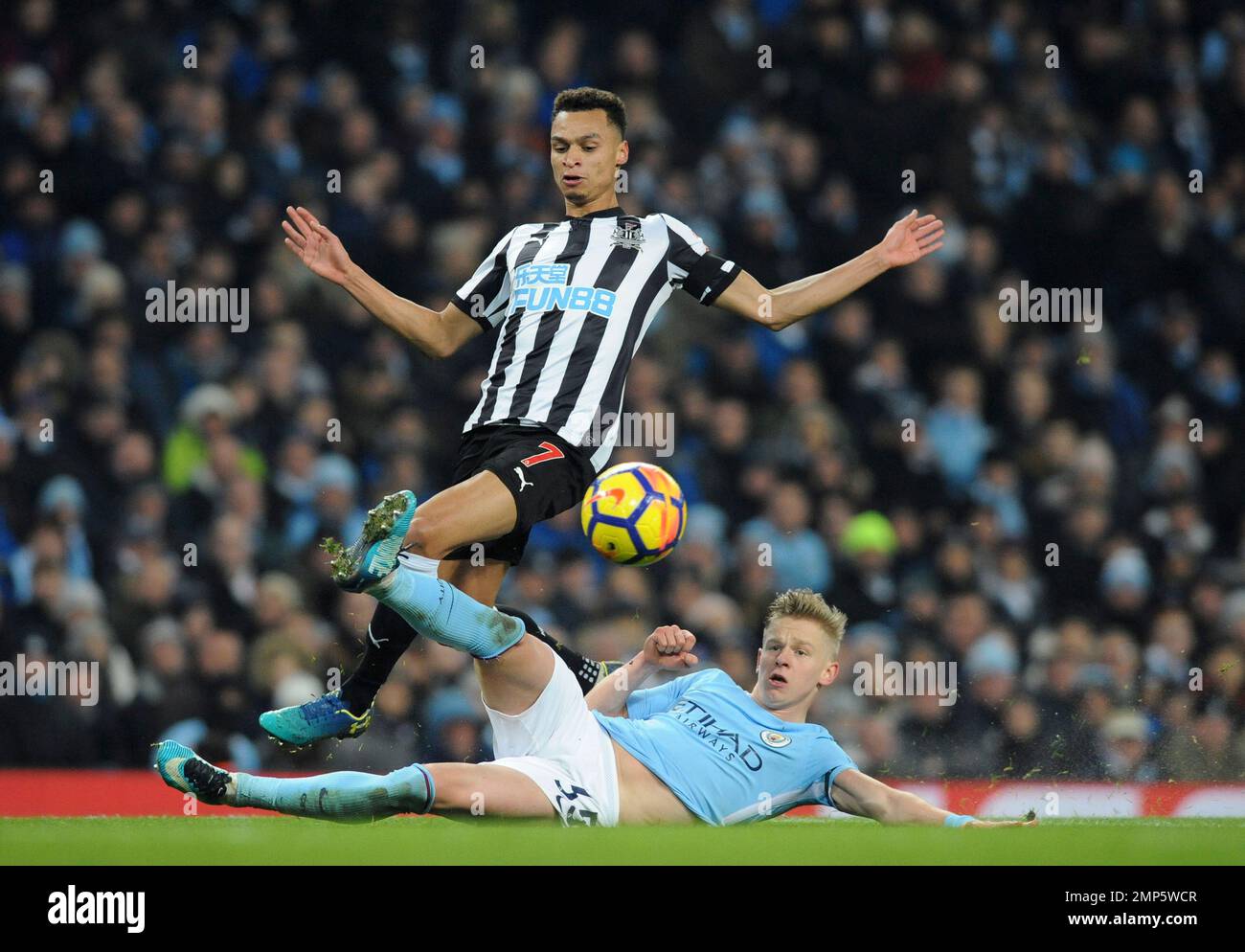 Manchester City's Oleksandr Zinchenko tackles Newcastle's Jacob Murphy