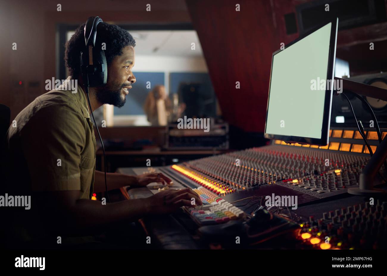 Happy, musician or technology mockup screen in music recording, sound mixing or studio song composition. Producer, happy or black man with computer Stock Photo
