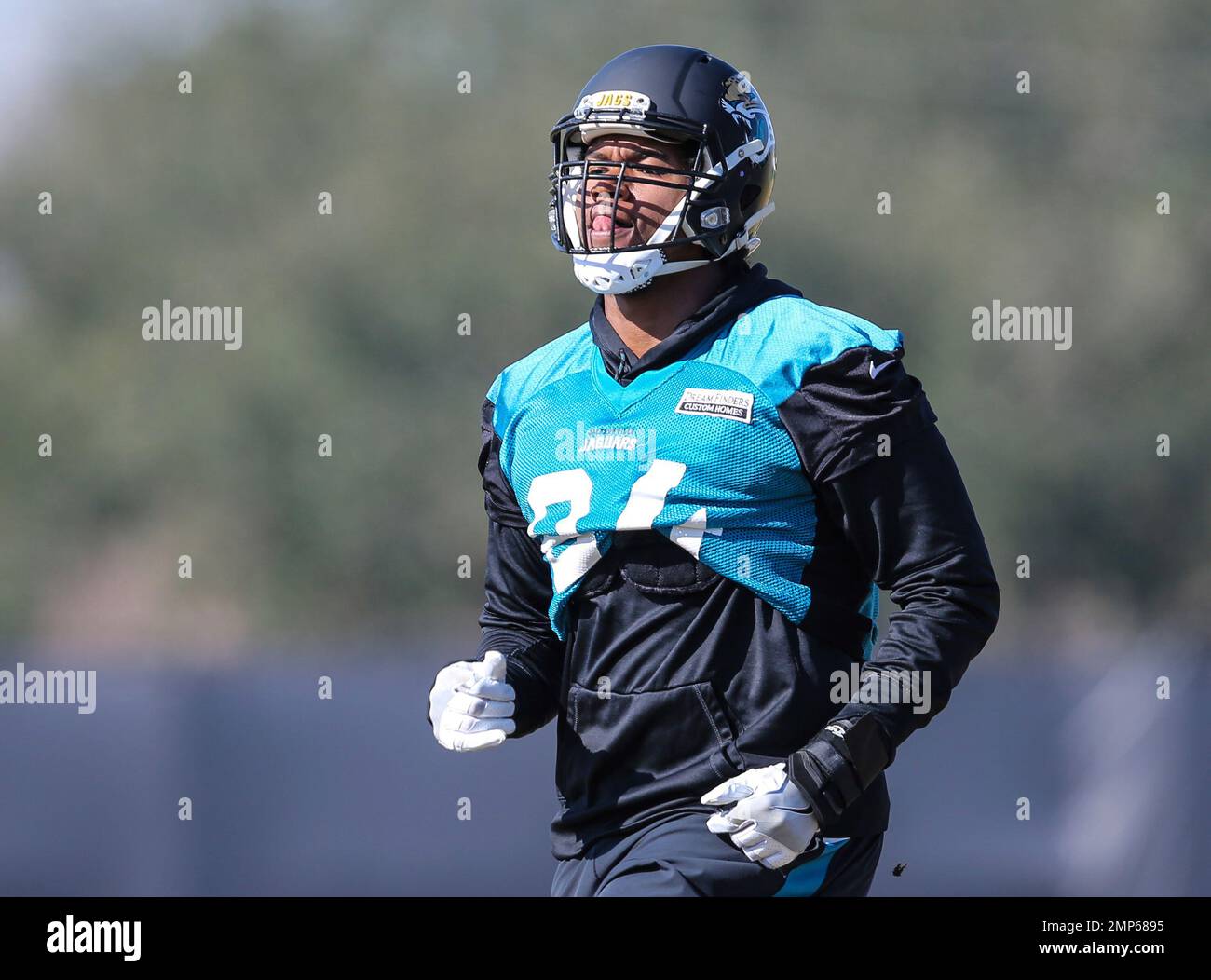 Jacksonville Jaguars defensive end Dawuane Smoot (94) runs a drill during  an NFL football practice in Jacksonville, Fla., Friday, Jan. 19, 2018. (AP  Photo/Gary McCullough Stock Photo - Alamy