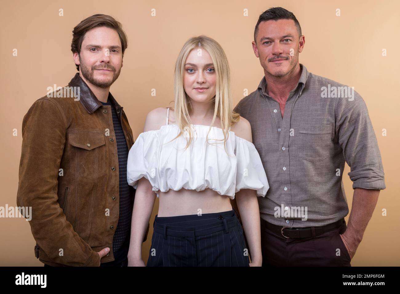 Daniel Bruhl, from left, Dakota Fanning and Luke Evans cast members in