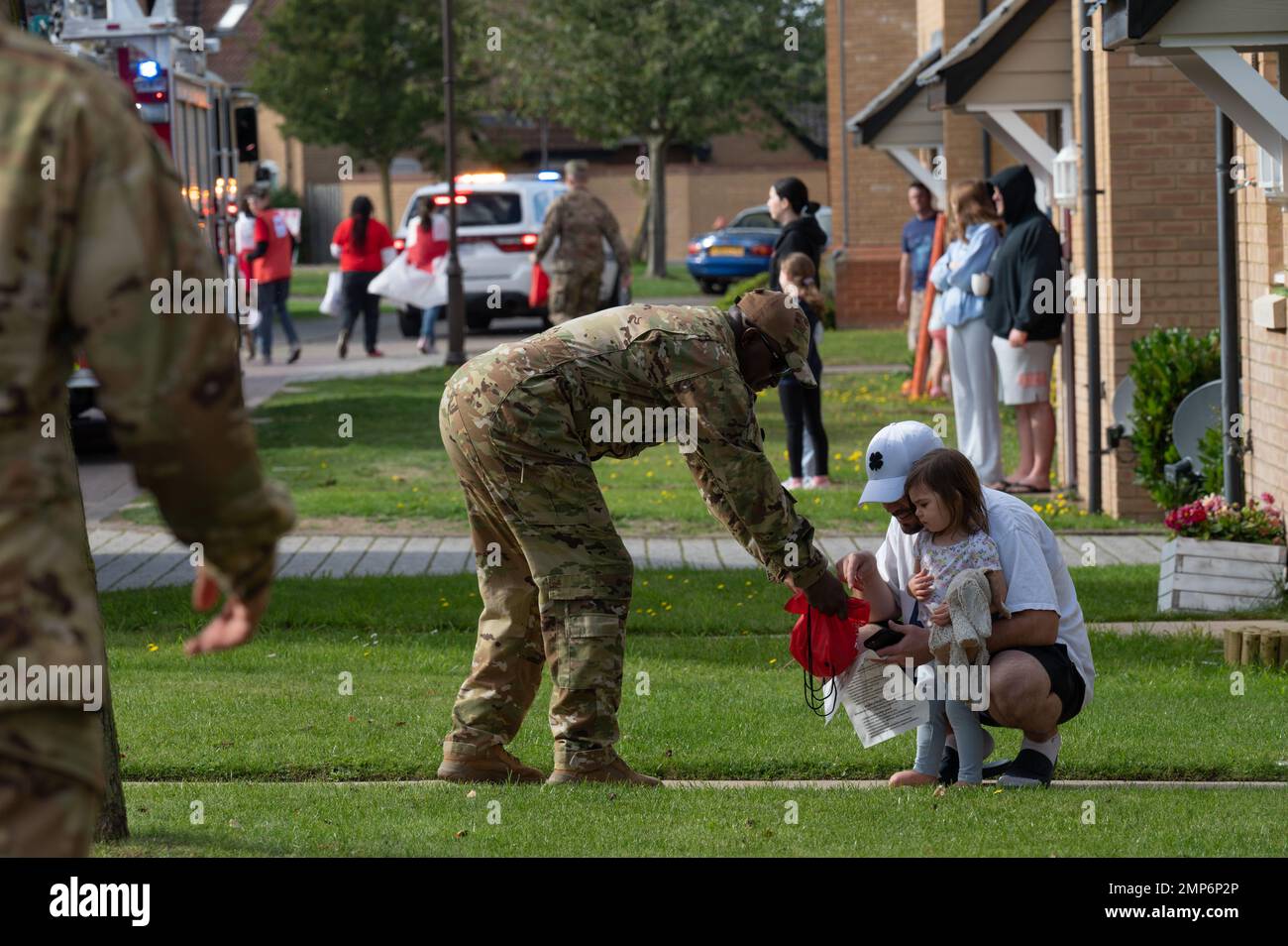 Senior Master Sgt. Charles Butcher hands out candy during the annual