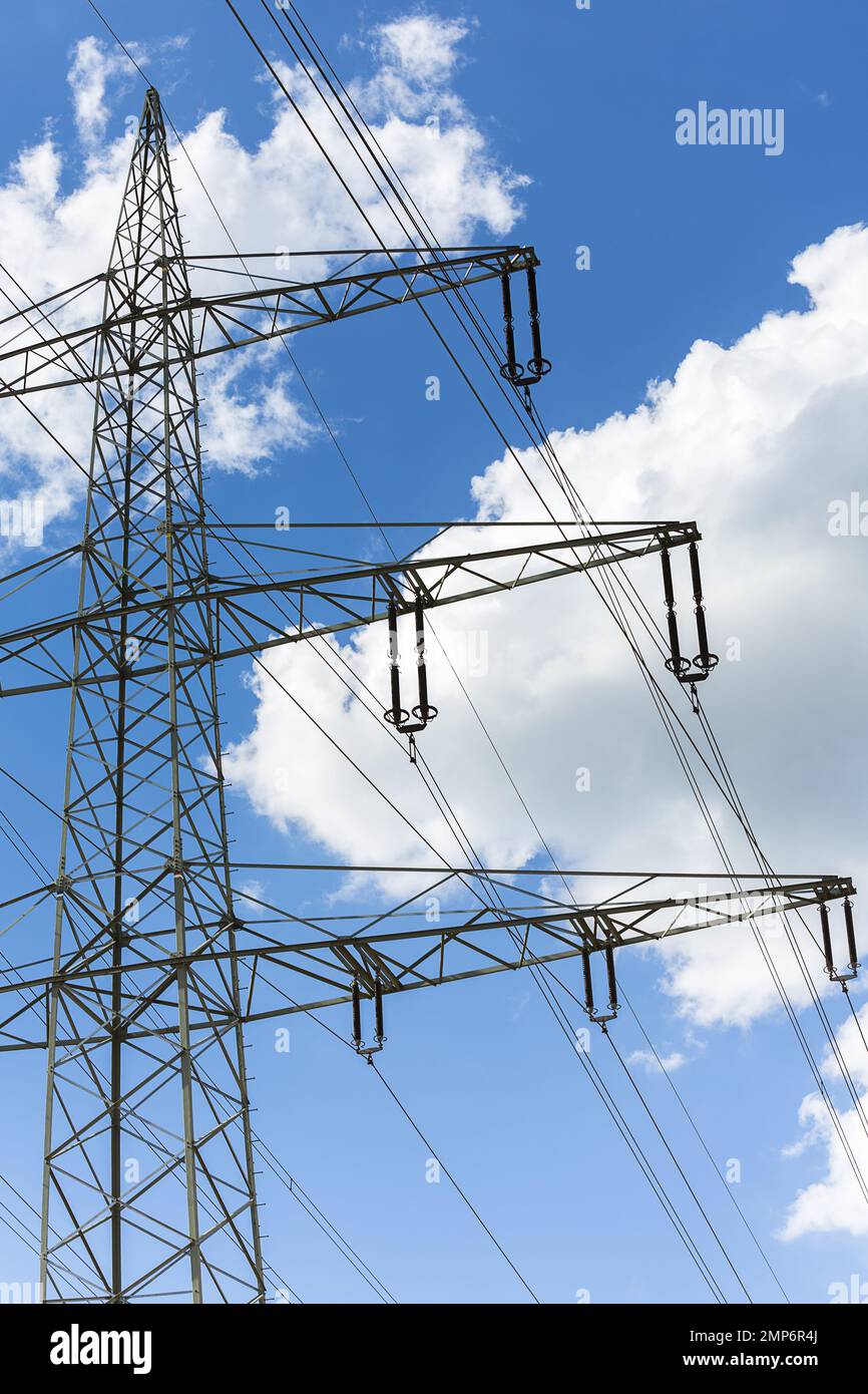 electricity pylon on blue cloudy sky industry high voltage Stock Photo ...