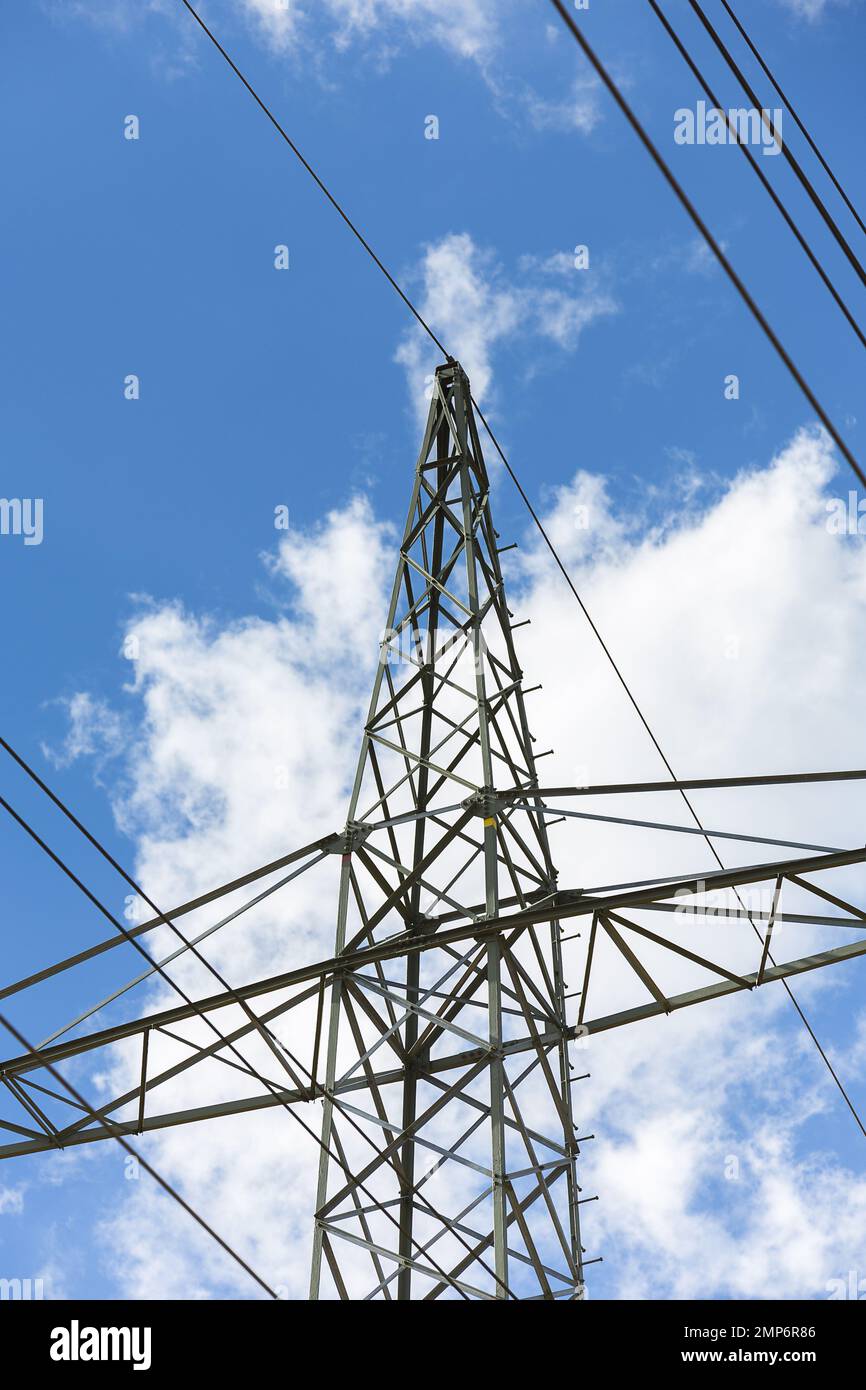 electricity pylon on blue cloudy sky industry high voltage Stock Photo ...