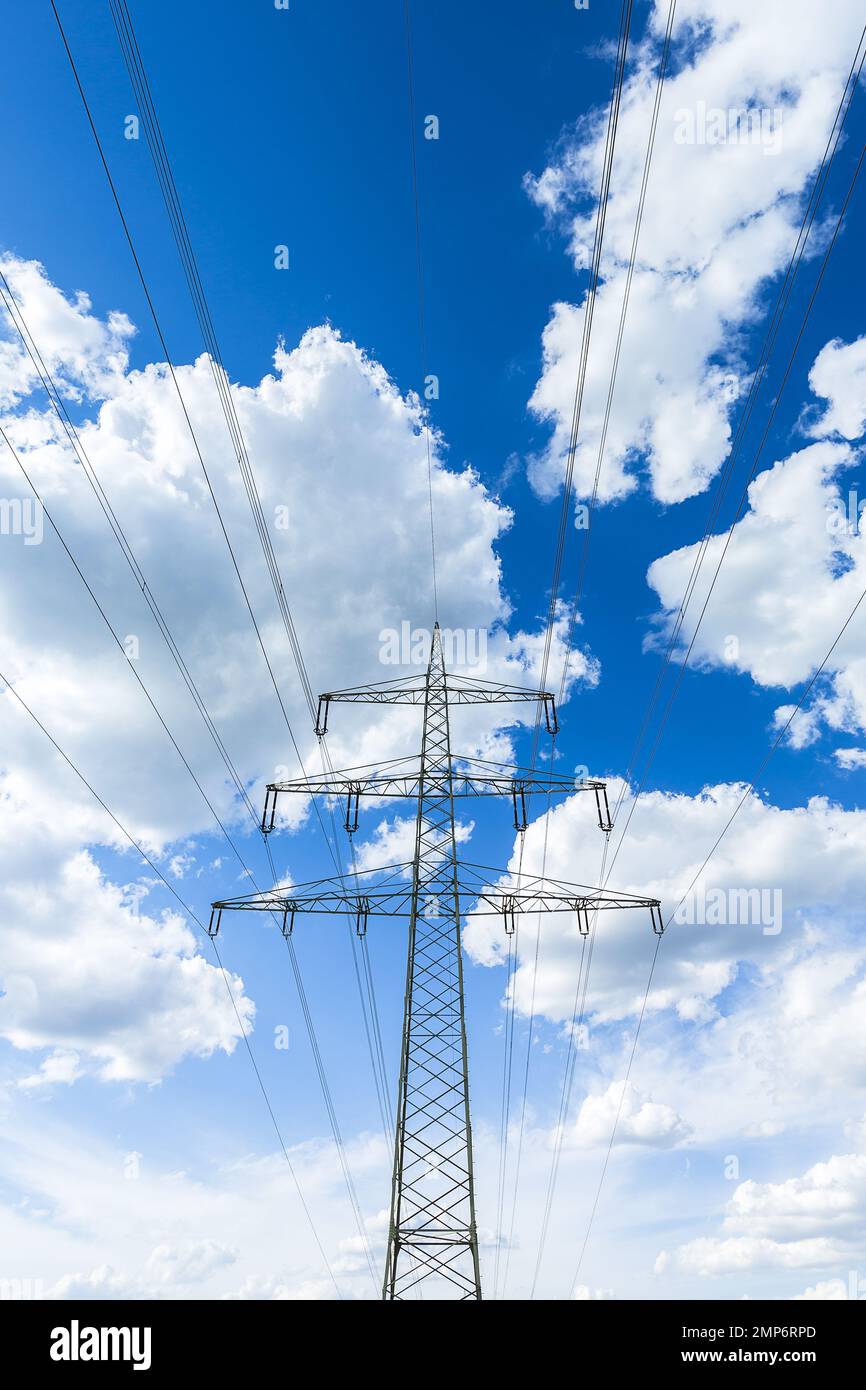 electricity pylon on blue cloudy sky industry high voltage Stock Photo ...