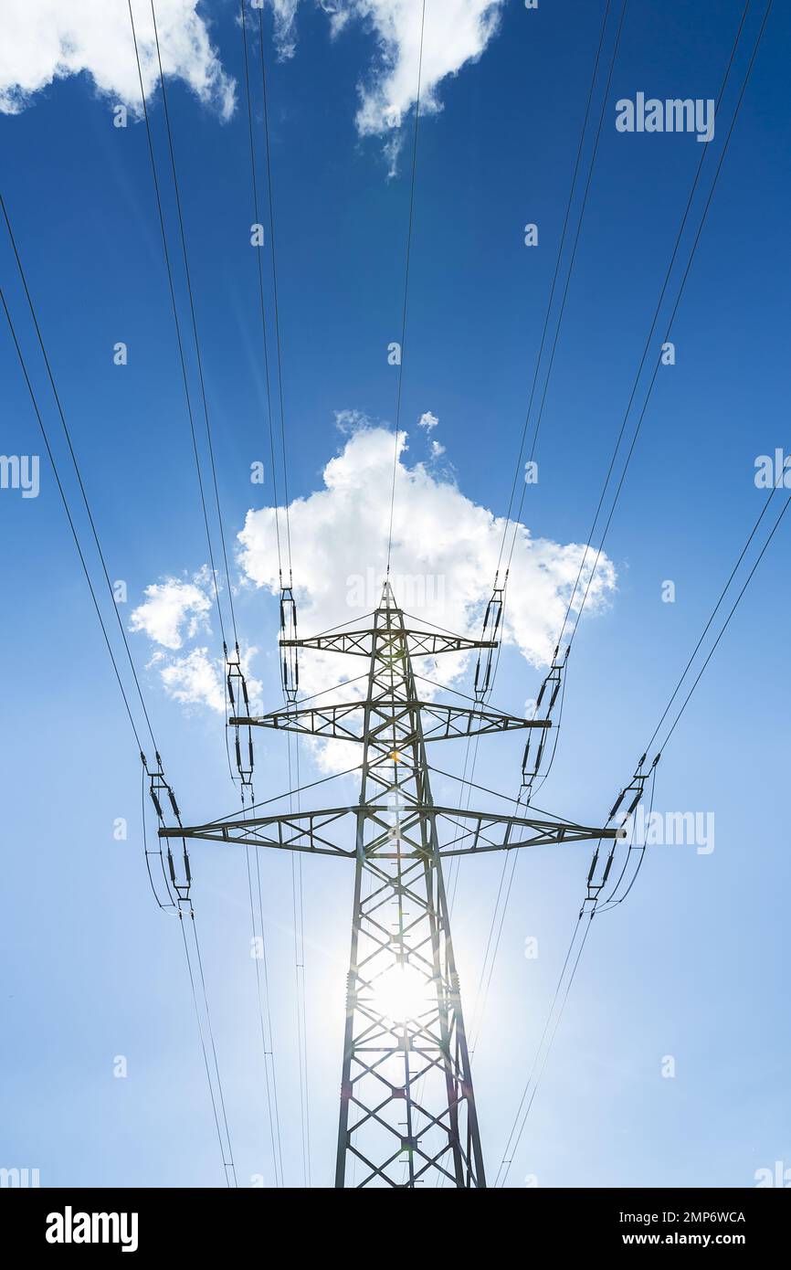electricity pylon on blue cloudy sky industry high voltage Stock Photo ...