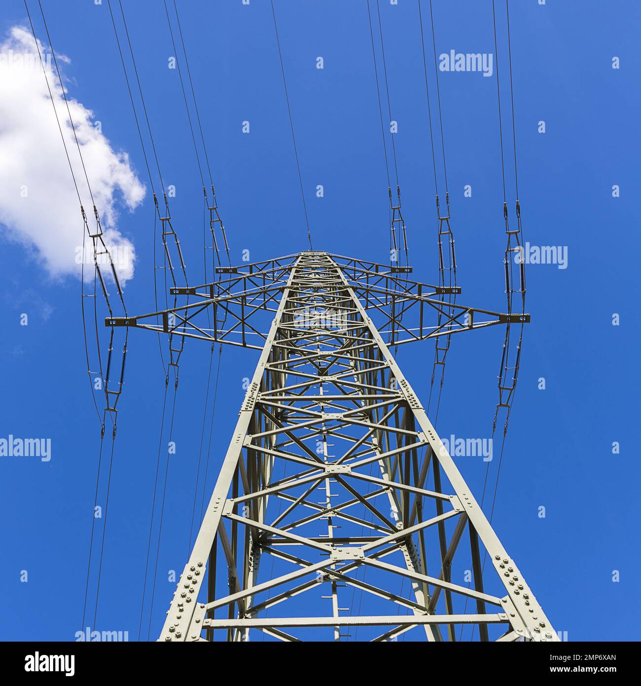 electricity pylon on blue cloudy sky industry high voltage Stock Photo ...