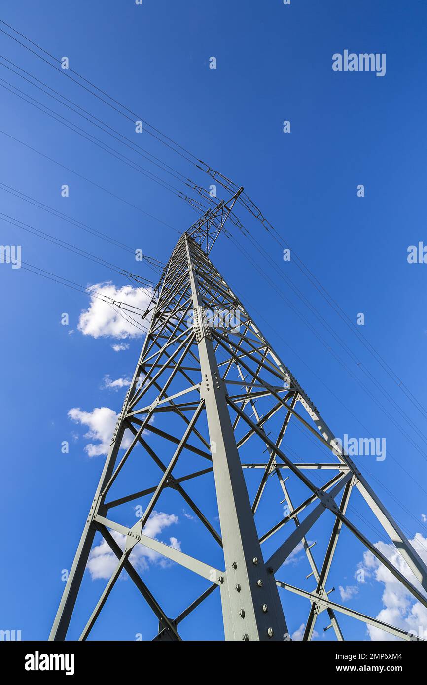 electricity pylon on blue cloudy sky industry high voltage Stock Photo ...