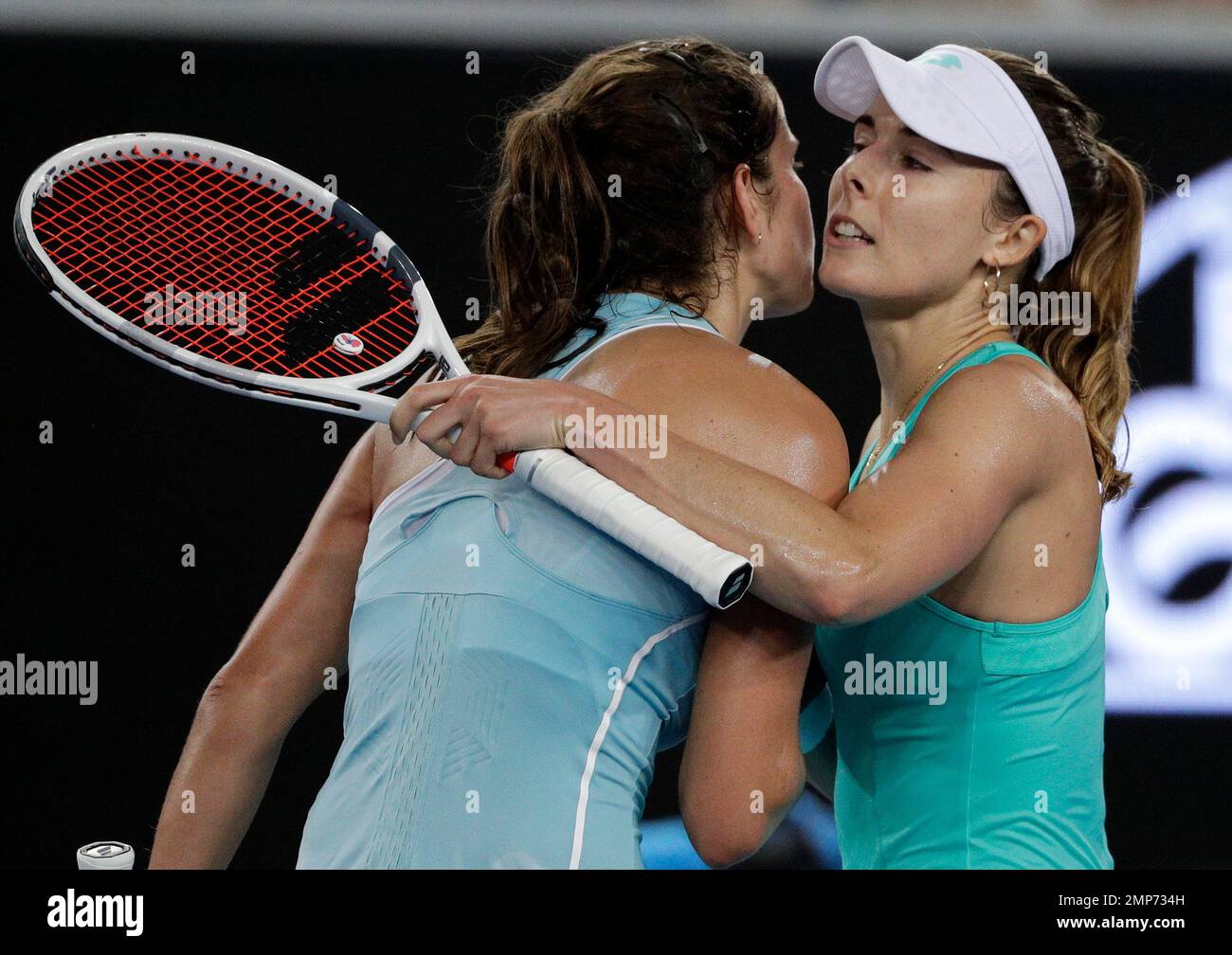 France's Alize right, is celebrated by Germany's Julia Goerges