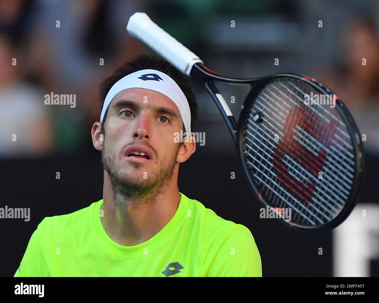 Argentina's Leonardo Mayer throws a racket while playing Spain's Rafael