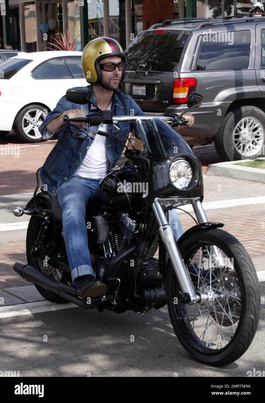 Maroon 5 singer Adam Levine arrives at Café Habana on his motorcycle