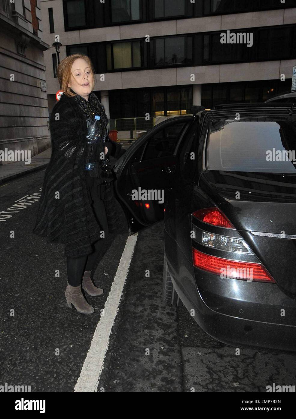 Singer Adele (aka Adele Adkins) arrives, big water bottle in hand, at
