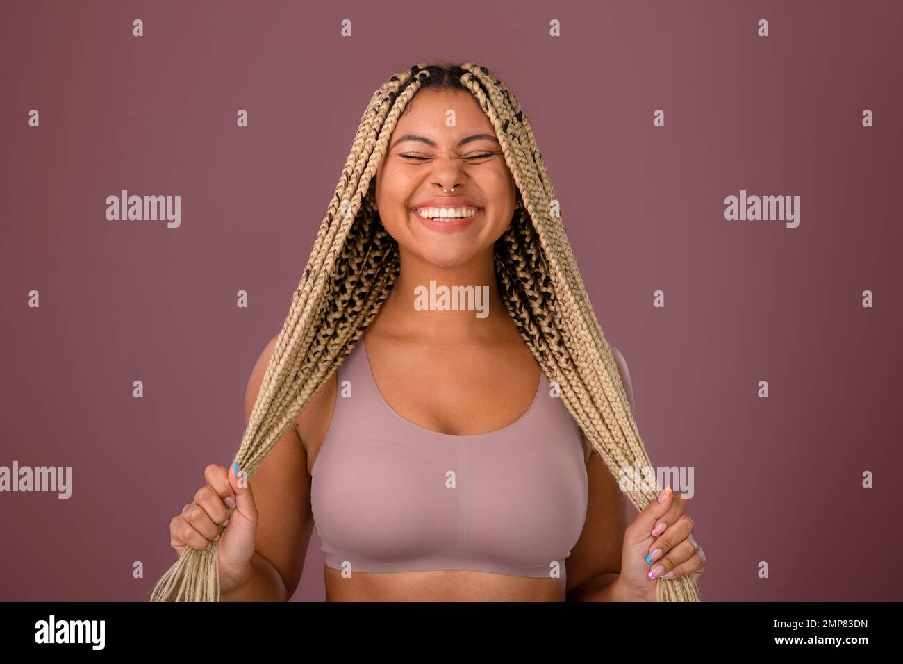 Portrait of happy multiracial woman, studio shoot. Stock Photo