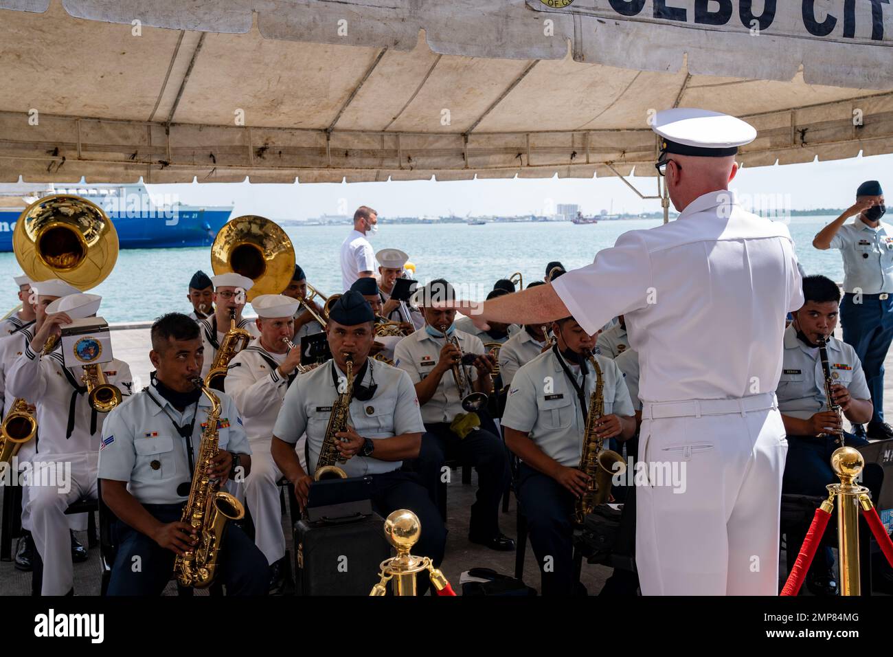 221011-N-DB724-2117  CEBU, Philippines (Oct. 11, 2022) Sailors assigned to the U.S. 7th Fleet Band play the national anthems of Australia, Philippines, and United States of America alongside airmen assigned to the Philippine Air Force during the opening ceremony of Exercise Sama Sama-Lumbas 2022 in Cebu, Philippines, Oct. 11. Sama Sama-Lumbas is a multilateral exercise and includes forces from Philippines, the United States, Australia, France, Japan, and the United Kingdom designed to promote regional security cooperation, maintain and strengthen maritime partnerships, and enhance maritime int Stock Photo