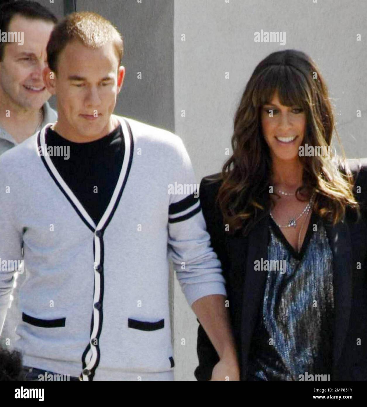 Singer Alanis Morissette holds hands with her husband of four months