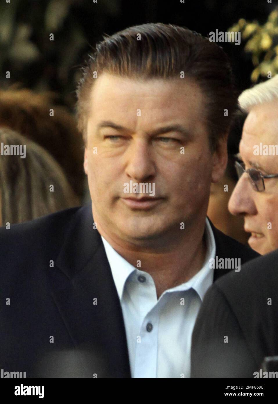 Alec Baldwin receives his star on the Hollywood Walk of Fame surrounded