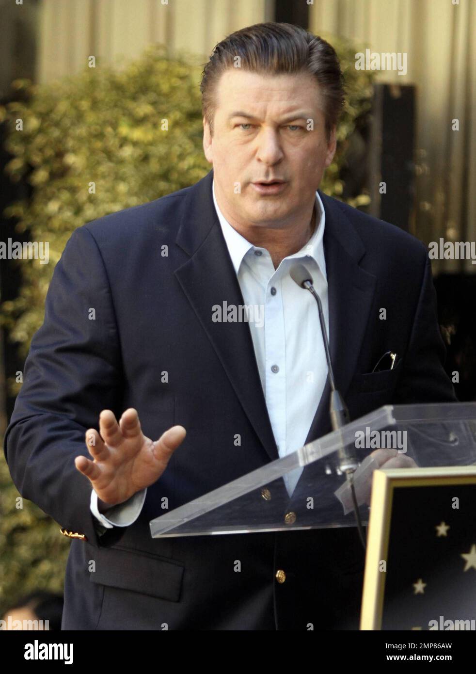 Alec Baldwin receives his star on the Hollywood Walk of Fame surrounded
