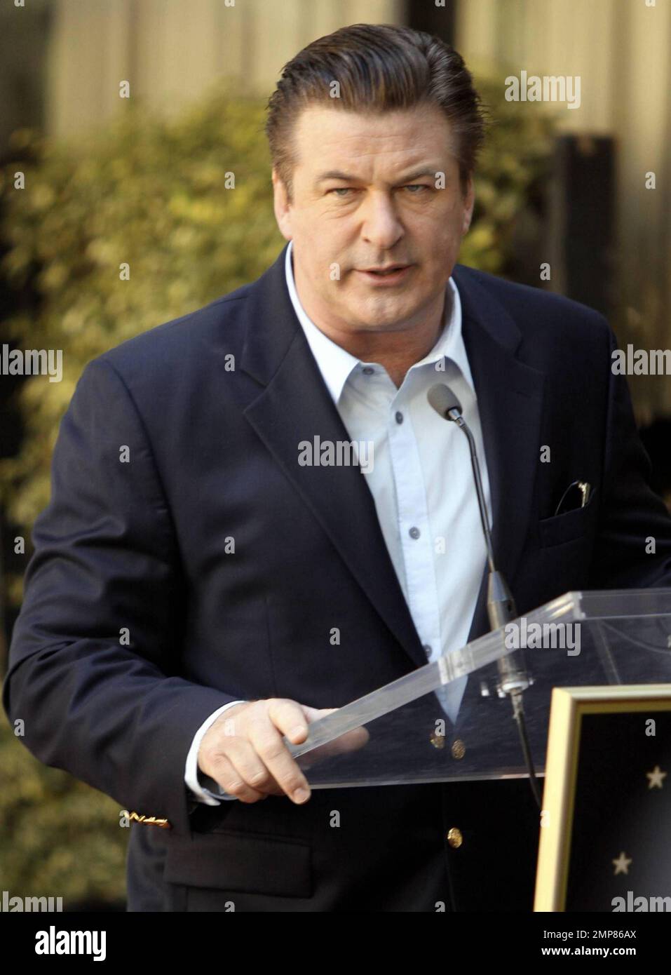 Alec Baldwin receives his star on the Hollywood Walk of Fame surrounded
