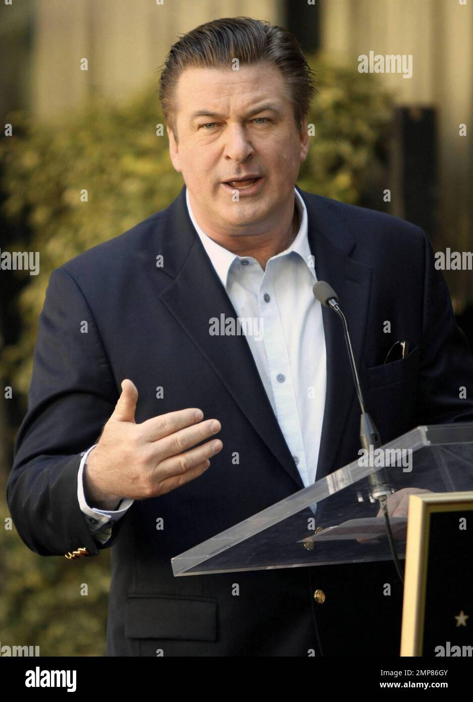 Alec Baldwin receives his star on the Hollywood Walk of Fame surrounded