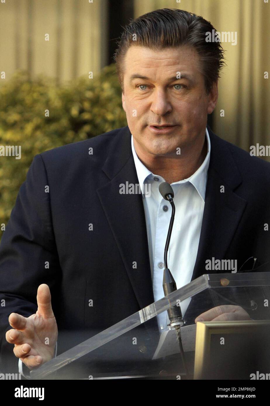 Alec Baldwin receives his star on the Hollywood Walk of Fame surrounded