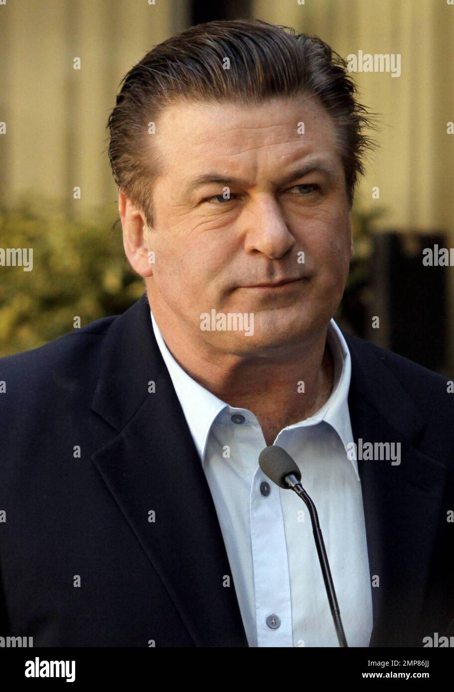 Alec Baldwin receives his star on the Hollywood Walk of Fame surrounded