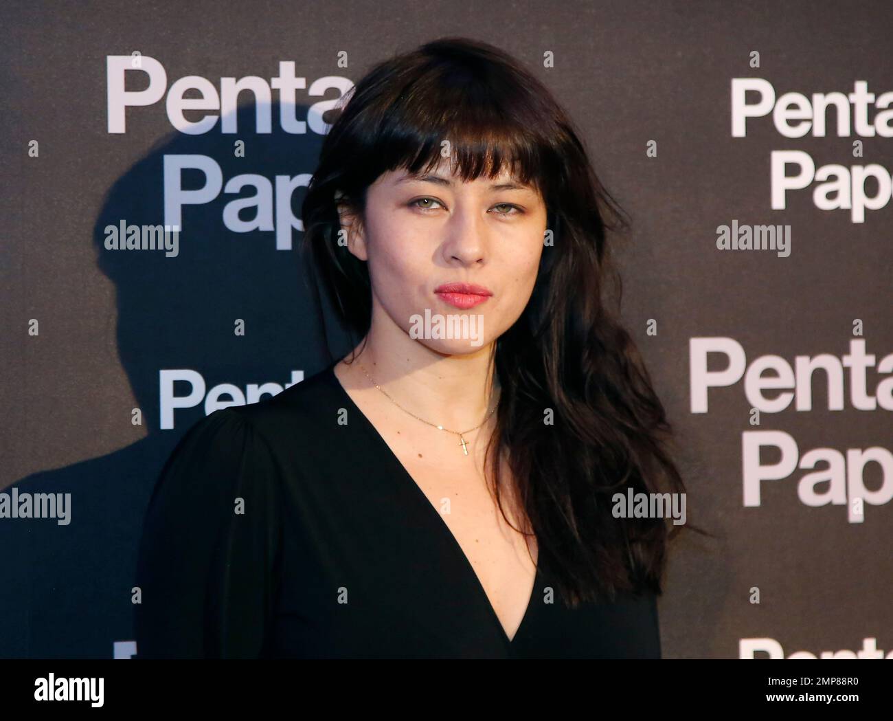 French actress Mylene Jampanoi poses for photographers on arrival at