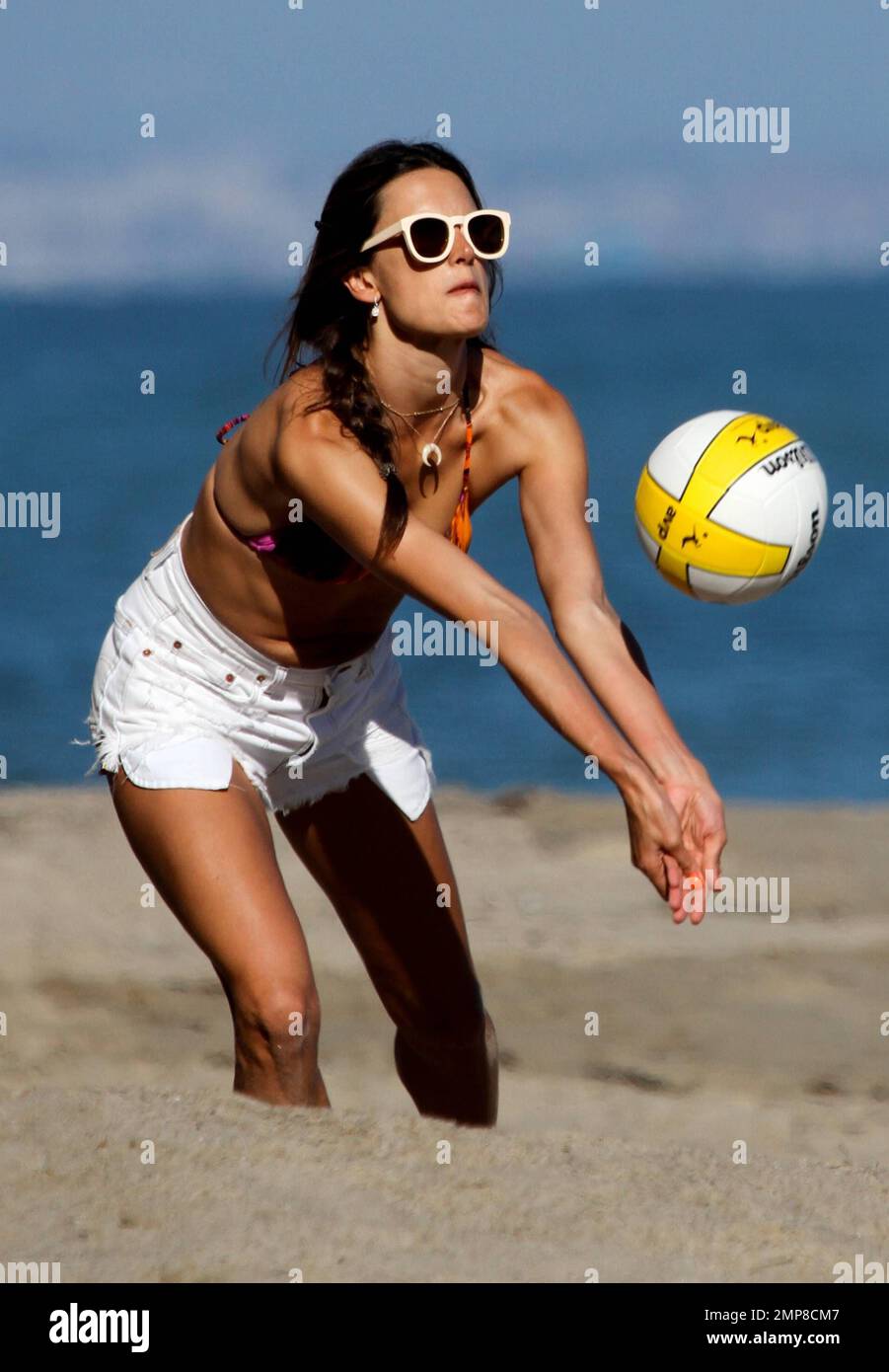 Wearing a multicolored bikini top with white cut-off shorts, supermodel Alessandra Ambrosio was seen spending the day in Malibu Beach with her 3 year old daughter Anja and fiance Jamie Mazur. Los Angeles, CA. 8th July 2012. Stock Photo