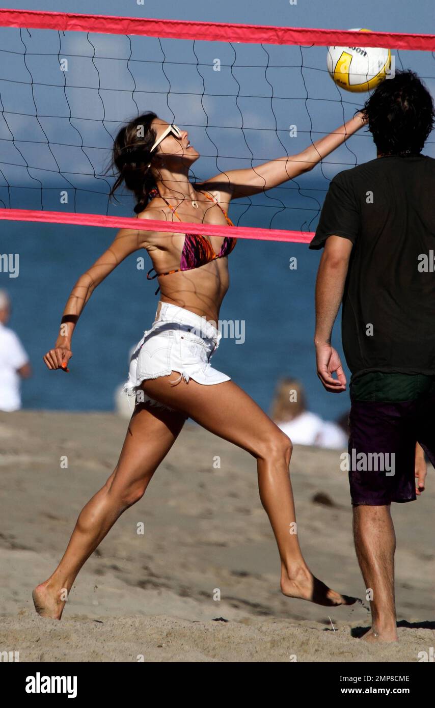 Wearing a multicolored bikini top with white cut-off shorts, supermodel Alessandra Ambrosio was seen spending the day in Malibu Beach with her 3 year old daughter Anja and fiance Jamie Mazur. Los Angeles, CA. 8th July 2012. Stock Photo