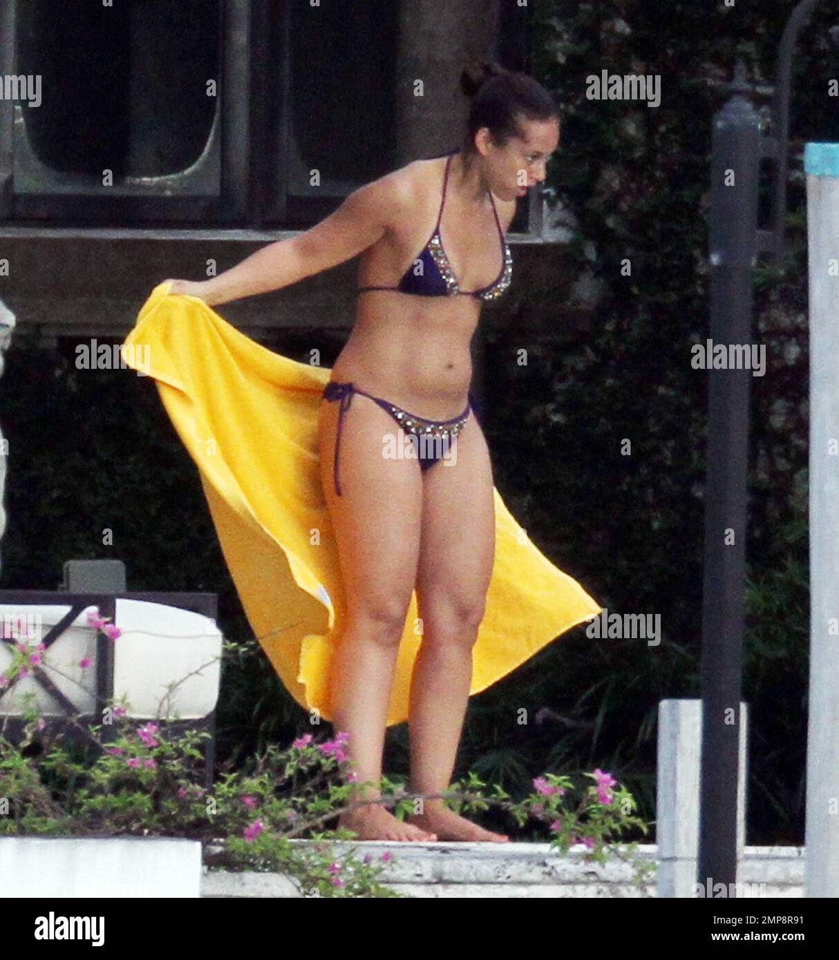 Alicia Keys shows off her post baby bikini body during a poolside break in  Miami, FL. 7/22/11 Stock Photo - Alamy