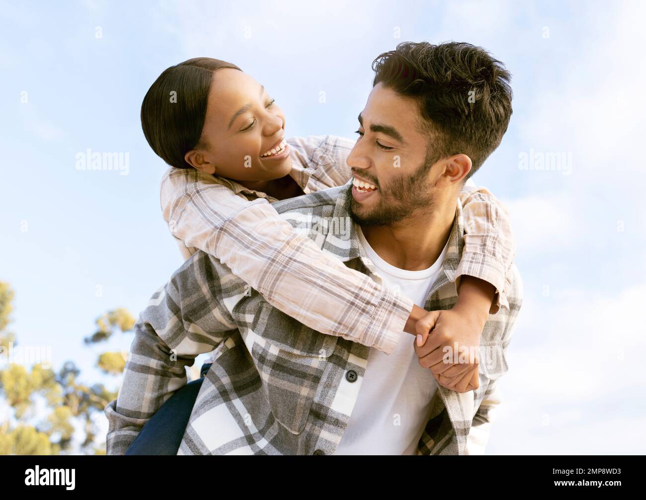 Nature sky, diversity and happy couple hug on outdoor time together, hiking adventure or forest trekking journey. Peace, freedom and love bond for Stock Photo