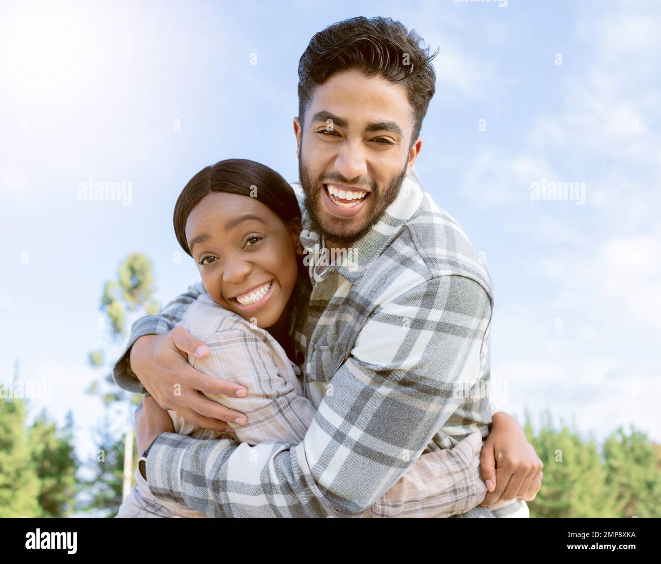 Couple, portrait smile and hug for summer vacation, travel or holiday break together outdoors. Happy man and woman hugging, smiling and enjoying Stock Photo