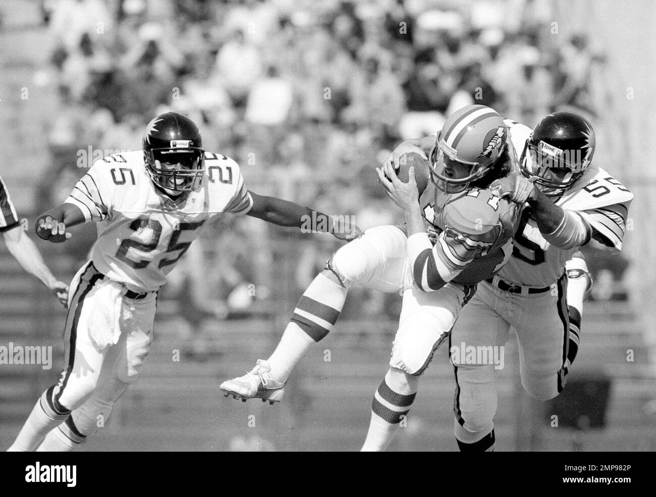 Oakland Invaders quarterback Bobby Hebert gets brought down with the ...