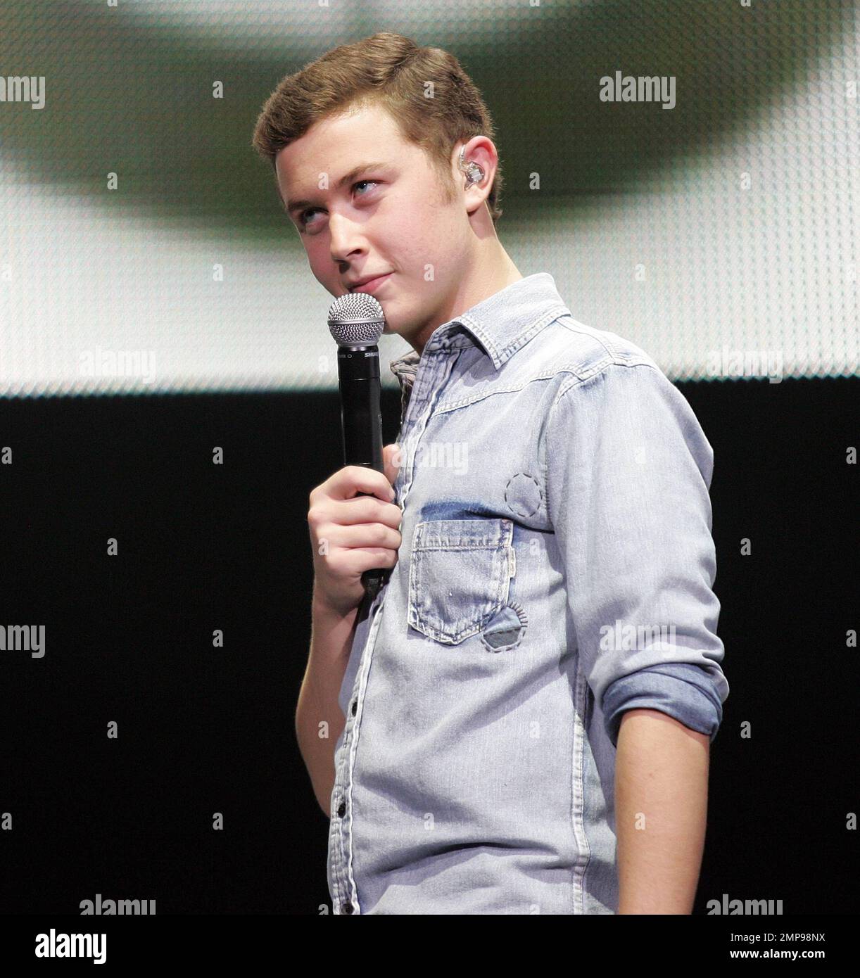 Season 10 winner Scotty McCreery performs in concert as part of the