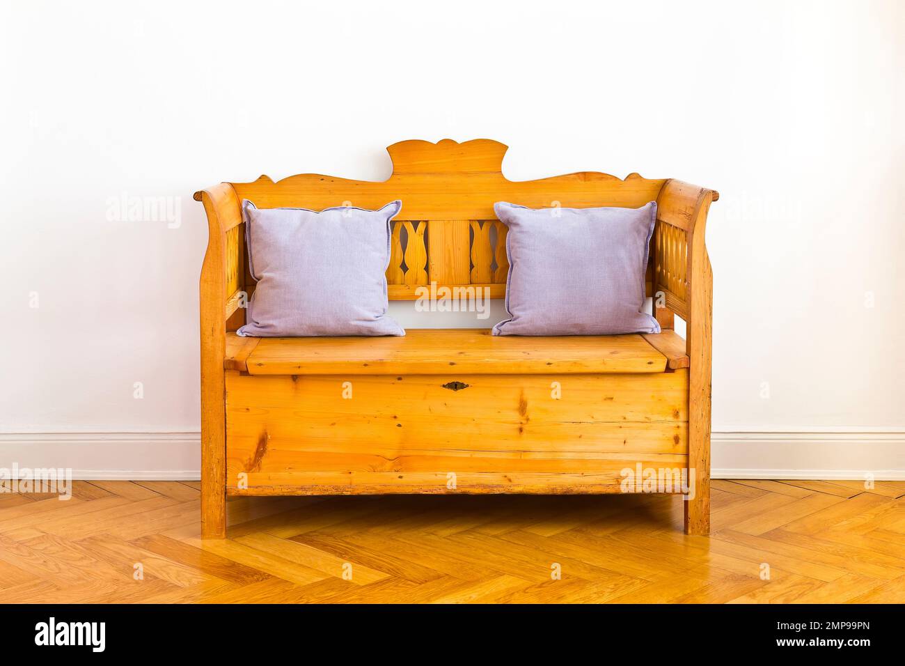Antique wooden chest bench with 2 pillows, storage space unter the seat