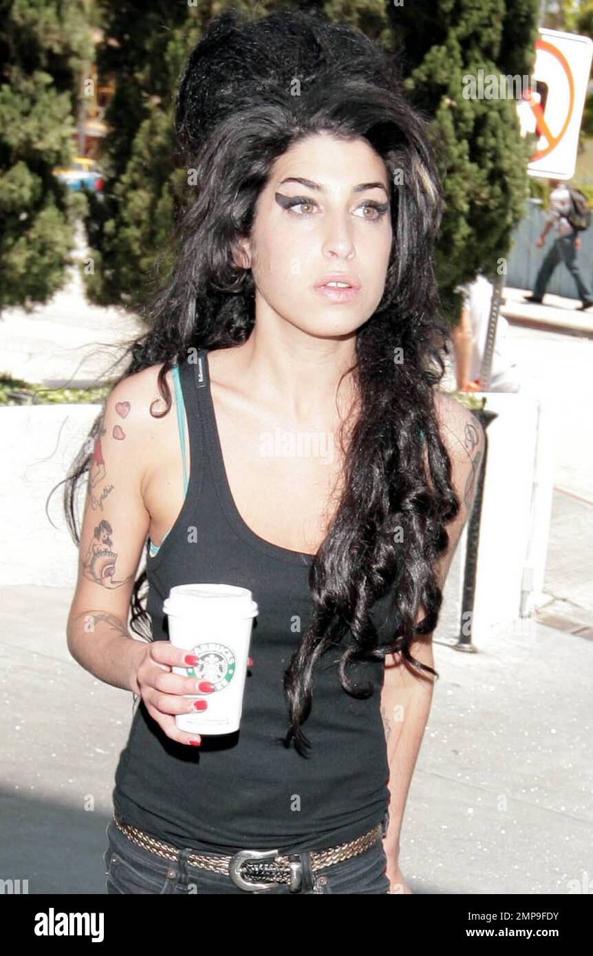 Amy Winehouse, aka the new Mrs. Fielder-Civil flashes her wedding ring on a  coffee run in West Hollywood, Calif. During her spritely walk, Amy nearly  lost her famous beehive, but made it