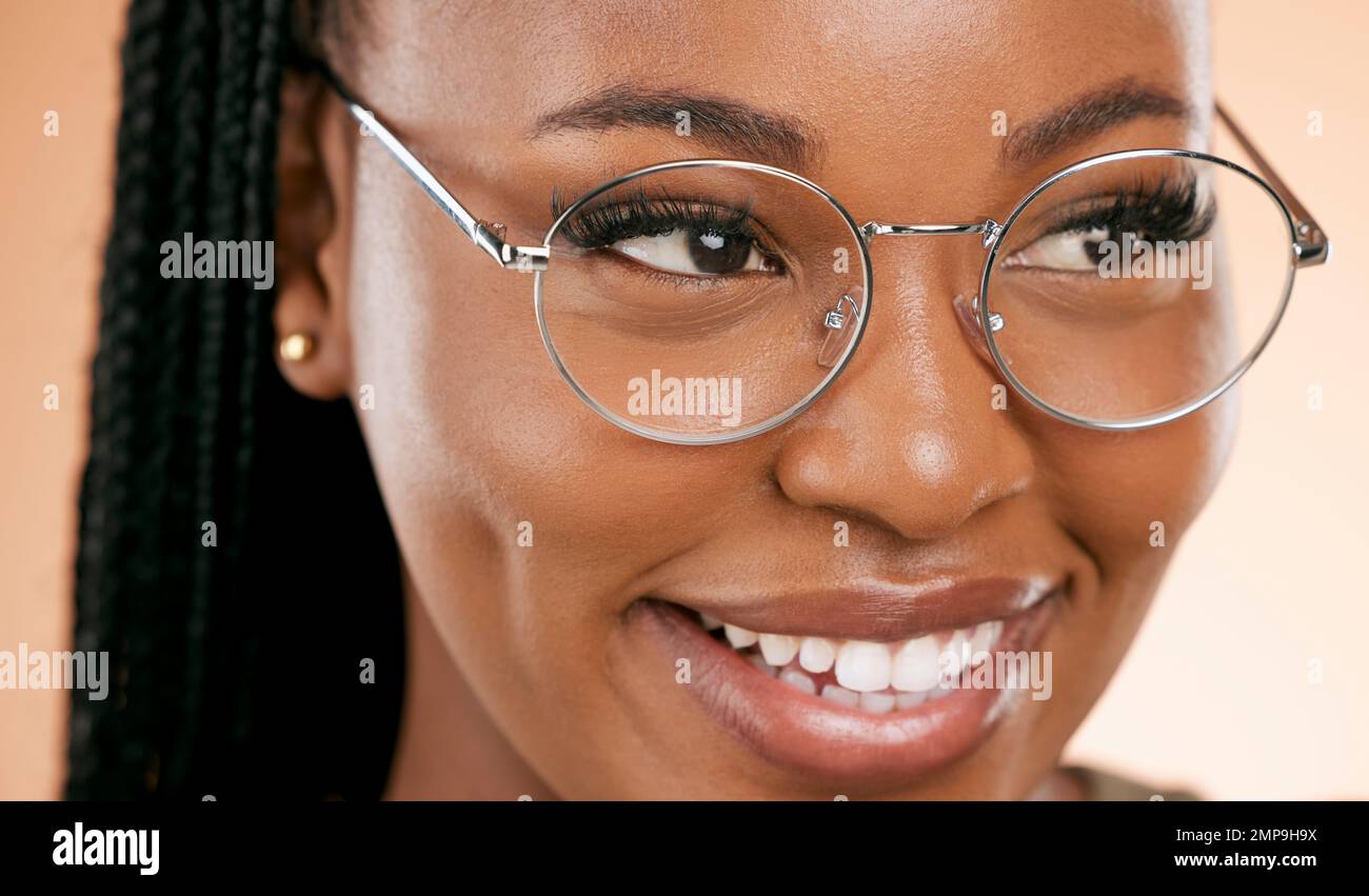 Black woman, face zoom and smile with glasses, vision and prescription