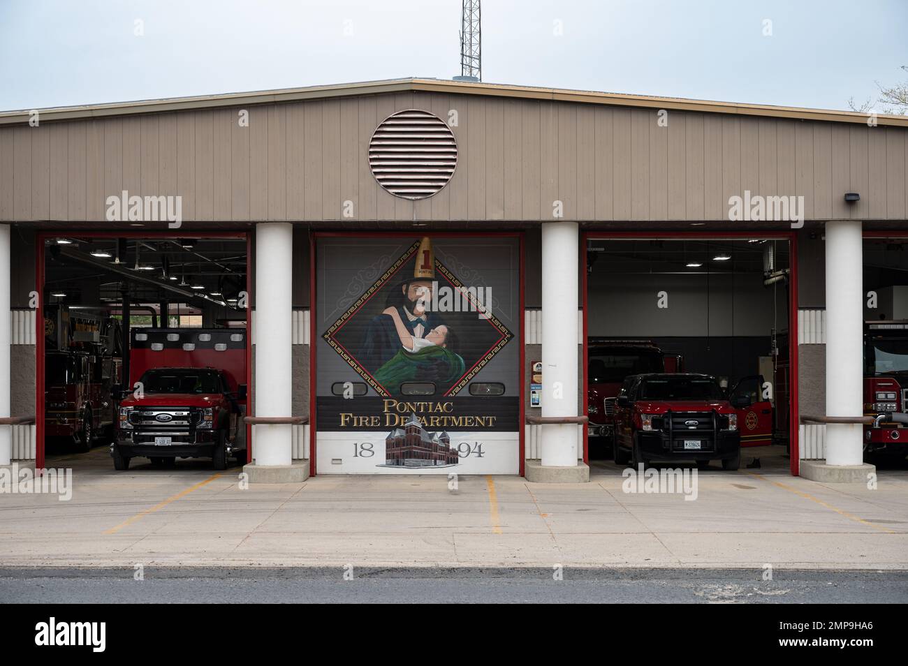 A scene of the old station of Pontiac Fire Department with fire trucks